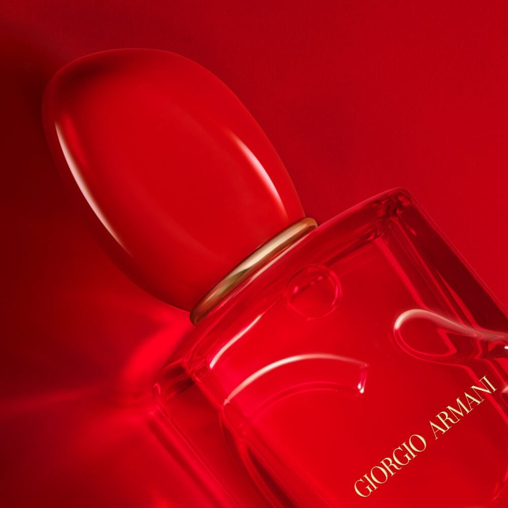Red Giorgio perfume bottle on a red background