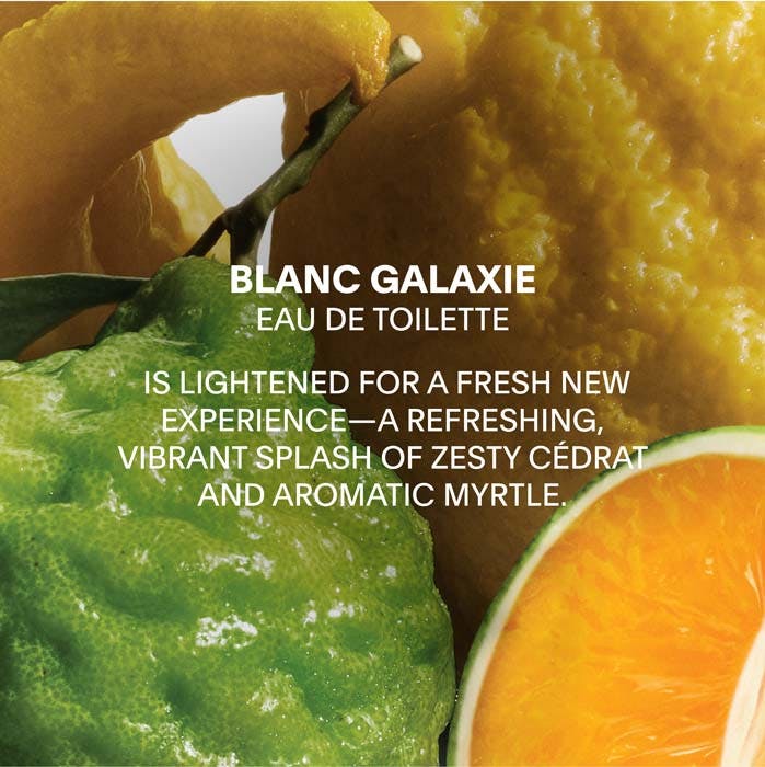 Advertisement for Blanc Galaxie Eau de Toilette with citrus fruits and green leaves.