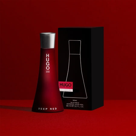 Deep Red perfume bottle and packaging on a red background
