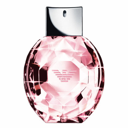 Pink diamond-shaped perfume bottle with a silver cap on a white background