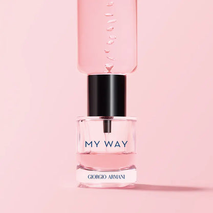 Perfume bottle labeled 'My Way' by Giorgio  on a pink background