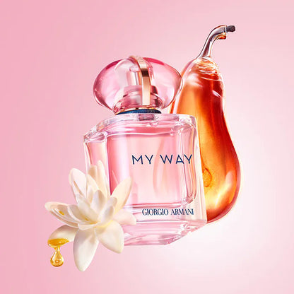 Giorgio perfume bottle with a flower on a pink background