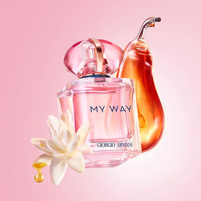 Giorgio  perfume bottle with a flower on a pink background