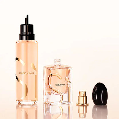 Giorgio perfume bottles on a reflective surface with a light background