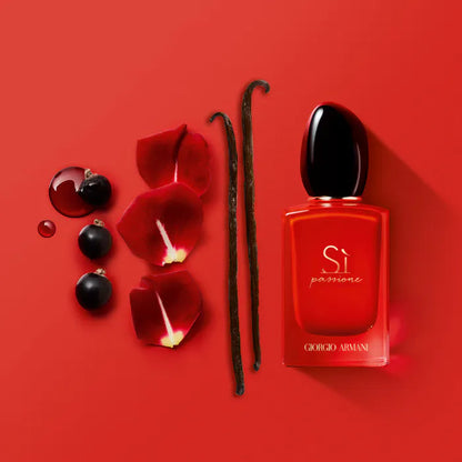 Red Giorgio perfume bottle with vanilla beans and rose petals on a red background