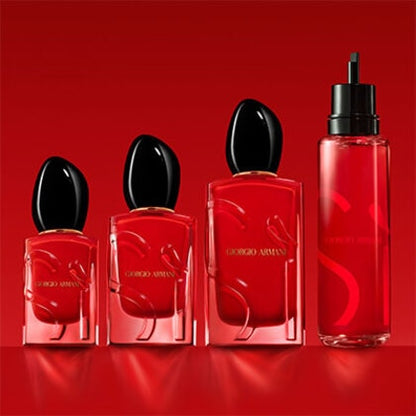 Set of red Giorgio perfume bottles on a red background
