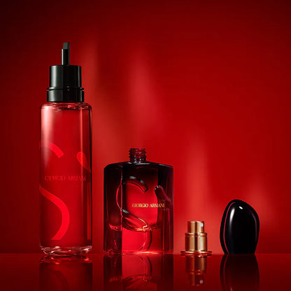 Three Giorgio  perfume bottles on a red background
