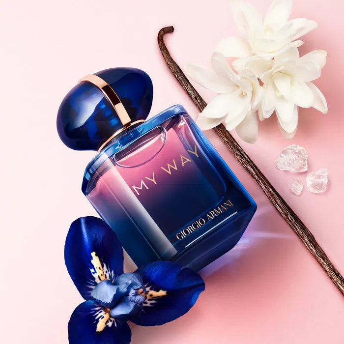 Giorgio My Way perfume bottle with flowers on a pink background
