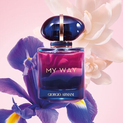 Giorgio My Way perfume bottle with flowers on a pink background